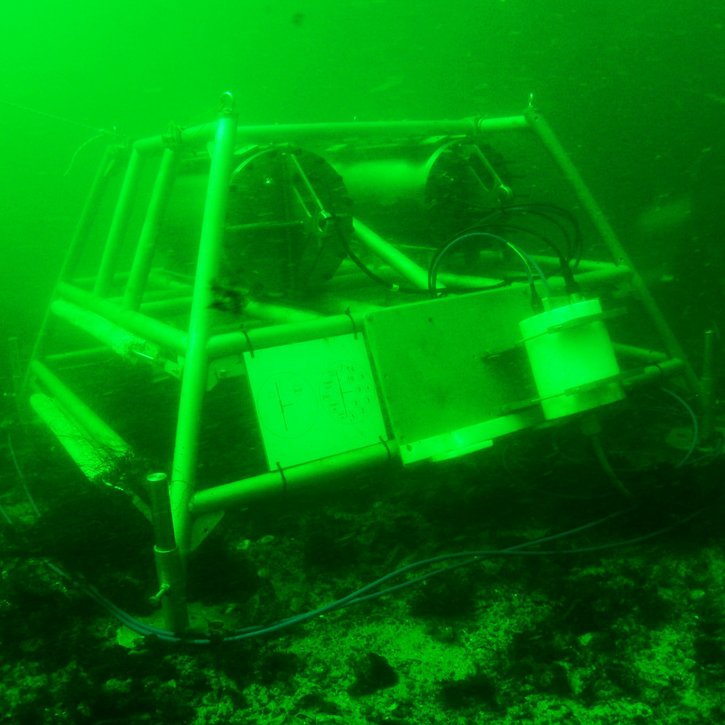 A cabinet-sized underwater station on the seabed.