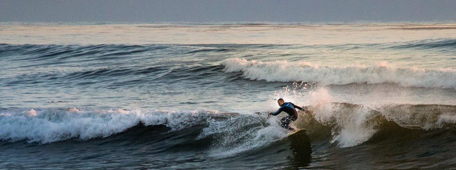 A surfer on a large wave.